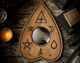 Ouija, drop pointer planchette, spiritualism or mystical or gothic decorative accessory, esoteric engraving on wood Vintage Object