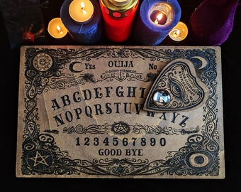 Vintage and Authentic Ouija Board, Wood Engraving with Pointer and Glass Eye. Spiritism, Cabinet of Curiosities, Esotericism